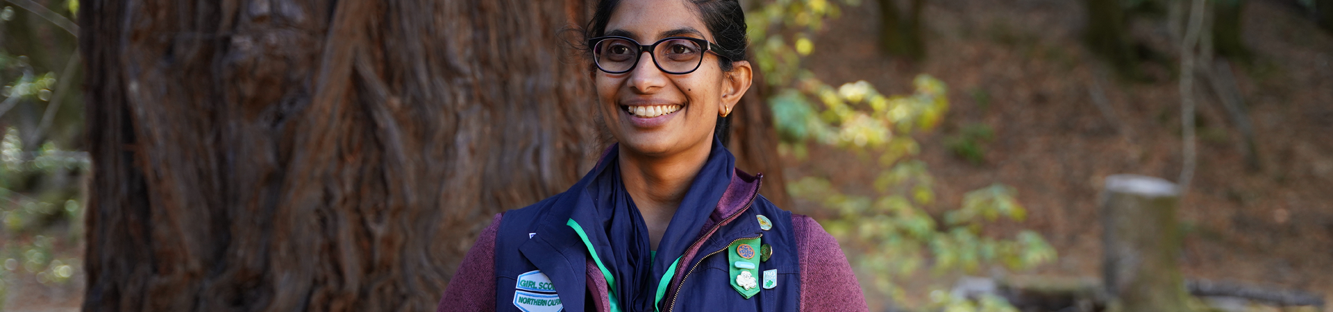  adult woman girl scout volunteer outdoors smiling 
